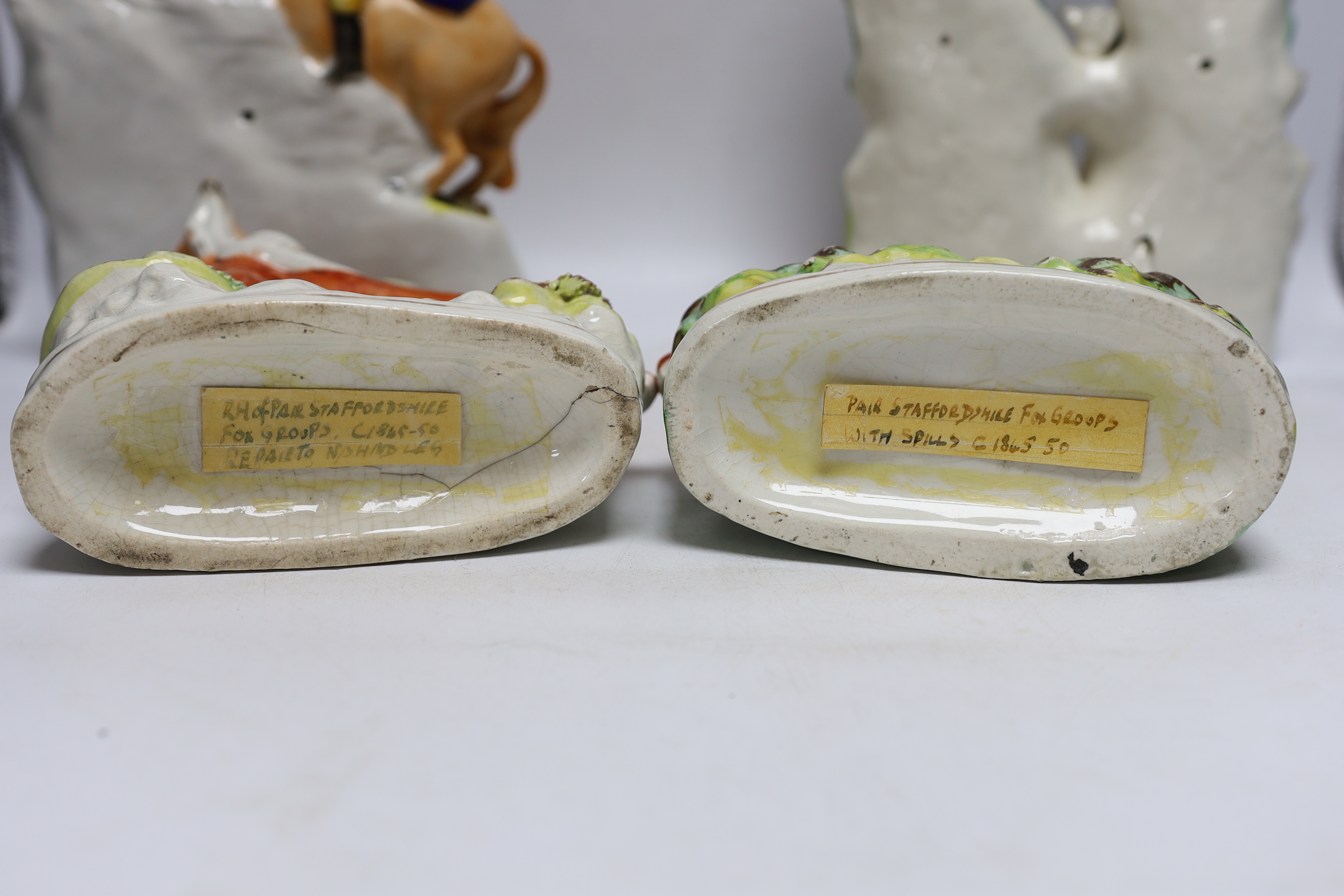 Two mid 19th century Staffordshire hunting figure groups and a pair of fox spill vases, 33cm